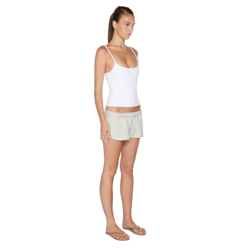naom Tank Top in White - three-quarter full body view on model