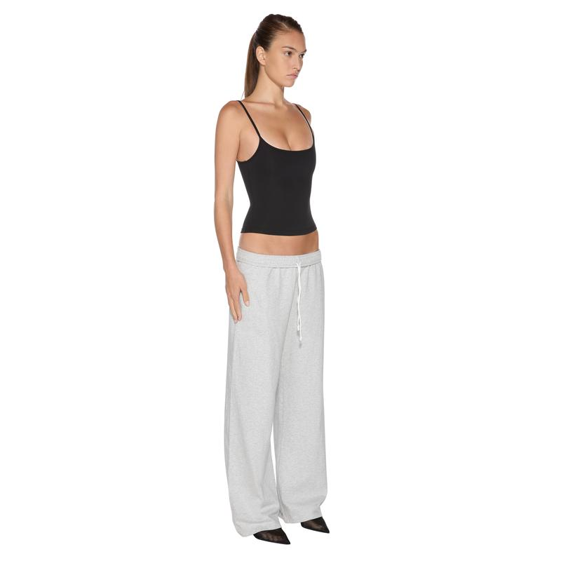 naom Tank Top in Black - three-quarter full body view on model